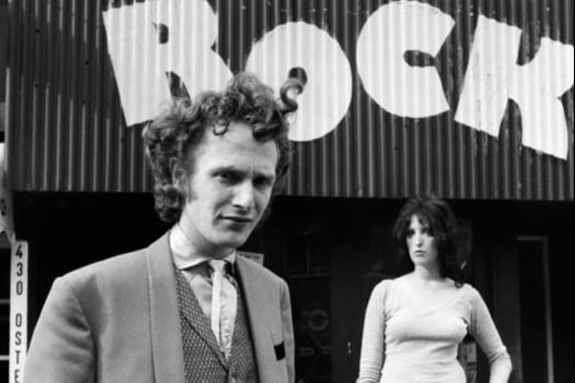 Malcolm McLaren dressed as a teddy boy outside his shop, Let it Rock, on the King’s Road on March 14, 1972. (Photo Mirrorpix/Omnibus)