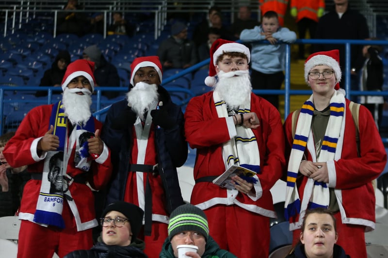Fans of Leeds United dress up as Santa Claus during the friendly match between Leeds United and AS Monaco