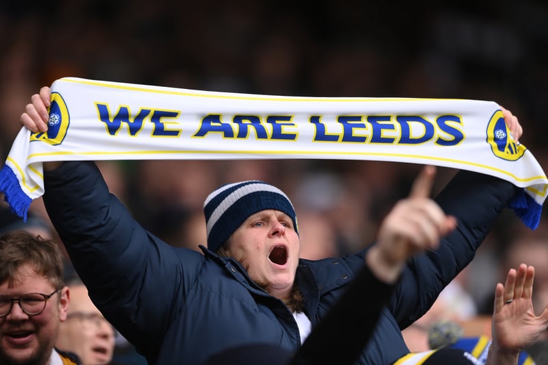 A Leeds supporter with a “We Are Leeds” scarf supports her team during the Premier League match between Leeds United and Brighton & Hove Albion