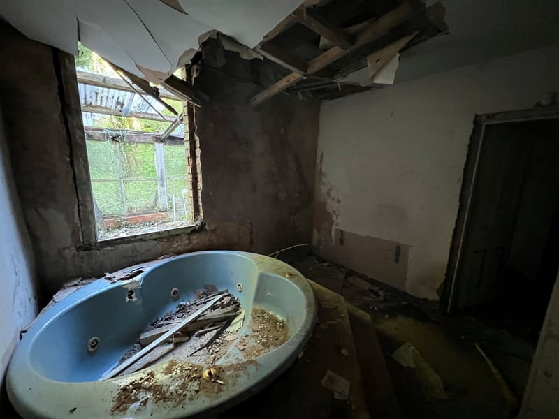 The old bathroom inside the property