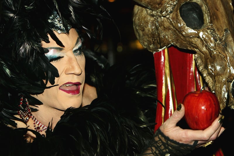 Lily Savage poses dressed as the wicked queen at the photocall for “Snow White and the Seven Dwarfs” at The Victoria Palace Theatre on July 7, 2004.