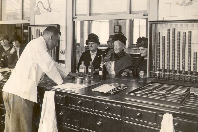 Female patients waiting at the dispensary counter, Outpatients department, St Bartholomew's Hospital to be issued with medicine, c1929