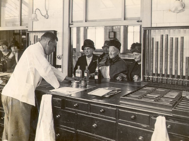 Female patients waiting at the dispensary counter, Outpatients department, St Bartholomew's Hospital to be issued with medicine, c1929