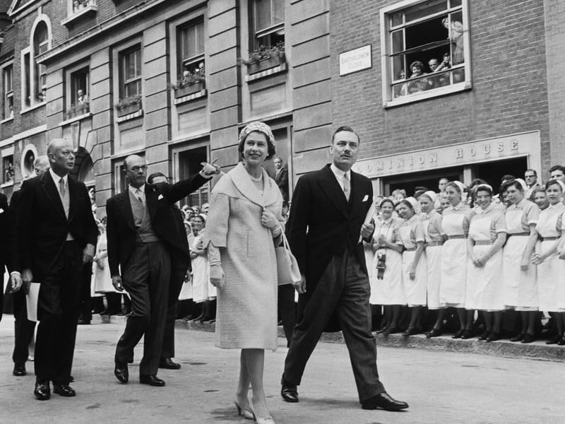 The Queen (1926 - 2022) with the Duke of Gloucester (first from left, 1900 - 1974) during a visit to St Bartholomew’s Hospital in London on May 30 1961. The Queen opened a new hospital wing and the nurses’ home. (Photo by Evening Standard/Hulton Archive/Getty Images)