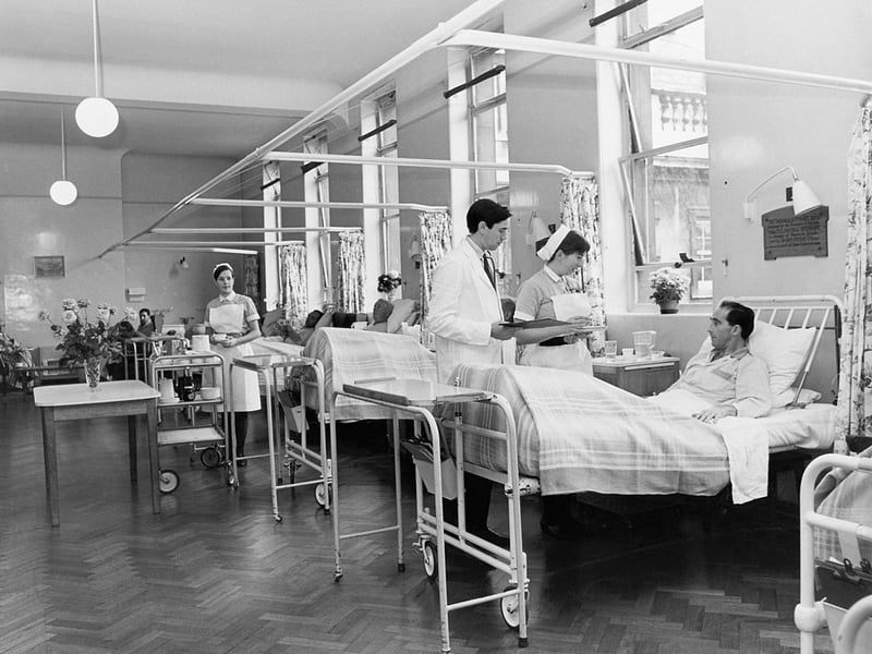 A doctor on his morning rounds in the men's surgical ward at St. Bartholomew's Hospital, London, February 1968. (Photo by George Freston/Fox Photos/Hulton Archive/Getty Images)