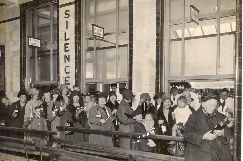   Reception desk and patients waiting in Outpatients hall, St Bartholomew's Hospital, c1929