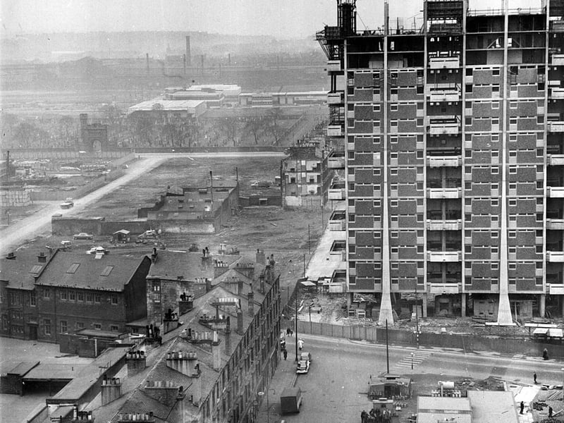  Modern housing under construction beside old tenements in the Gorbals. 