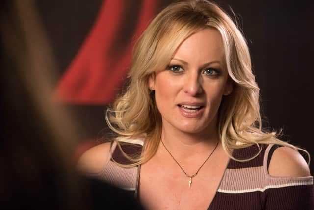 Stormy Daniels, the porn star who claims to have slept with US President Donald Trump over a decade ago, talks with a journalist during an interview at the Berlin erotic fair "Venus" in Berlin on October 11, 2018. (Photo by Ralf Hirschberger / dpa / AFP) / Germany OUT        (Photo credit should read RALF HIRSCHBERGER/DPA/AFP via Getty Images)