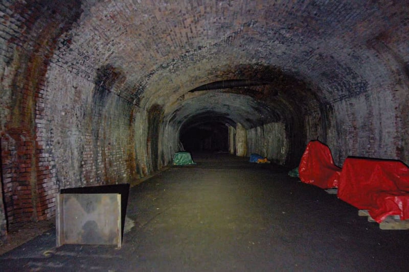 The Redcliffe Tunnel is a 282 yard long stretch with its entrance off Lower Guinea Street. It was used as part of the Harbourside Railway, which opened in 1872 before it was closed in 1964. Its construction involved the demolition of a nearby vicarage and the removal and re-internment of a graveyard at Arnos Vale cemetery.