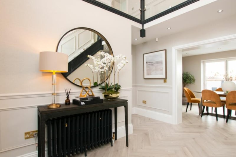 The property has a bright entrance hall with parquet flooring. 