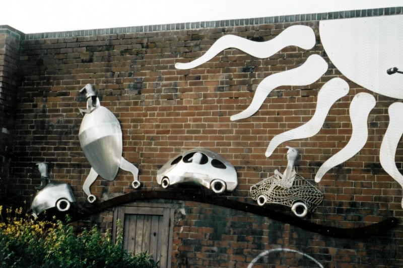 Car Mural Sculpture by Johnny White on the wall of Harratts Volvo Sheffield, Vulcan Foundry, Attercliffe Road. Nov 2004
