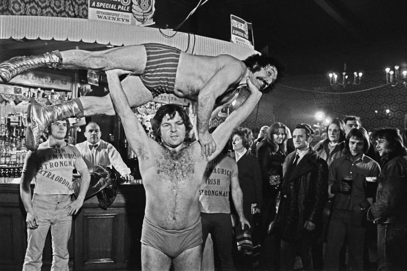 Former boxer Monty Swan holds his opponent Pedro the Gypsy above his head during a wrestling match at the Wellington.