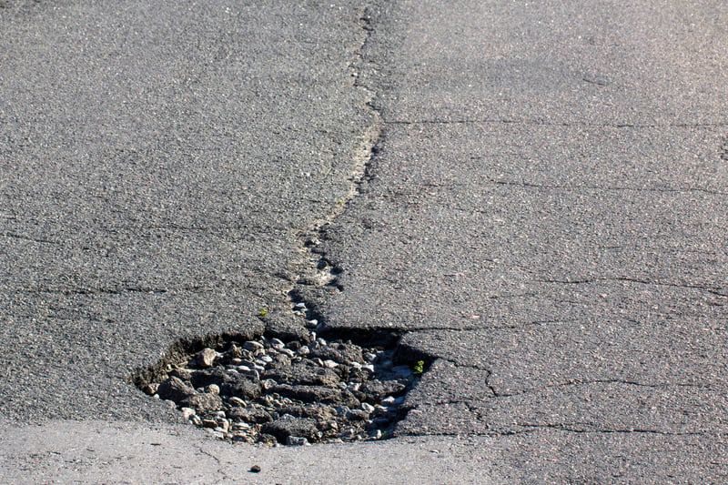 In 2022-23, Knowsley Council received four customer service requests regarding potholes on Bowring Park Avenue. (note - picture is a stock image)