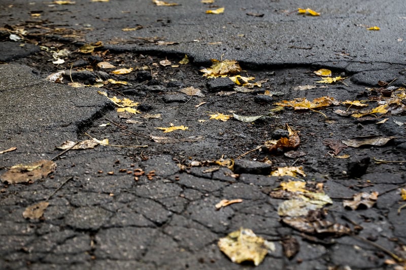 In 2022-23, Knowsley Council received four customer service requests regarding potholes on County Road. (note - picture is a stock image)