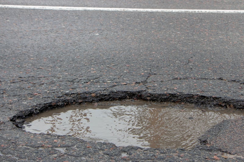 In 2022-23, Knowsley Council received four customer service requests regarding potholes on Okell Drive. (note - picture is a stock image)