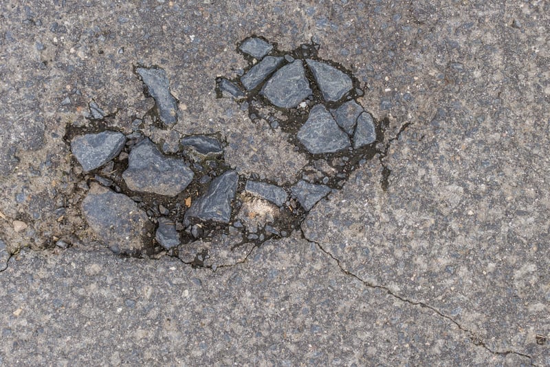 In 2022-23, Knowsley Council received six customer service requests regarding potholes on Liverpool Road, Prescot. (note - picture is a stock image)