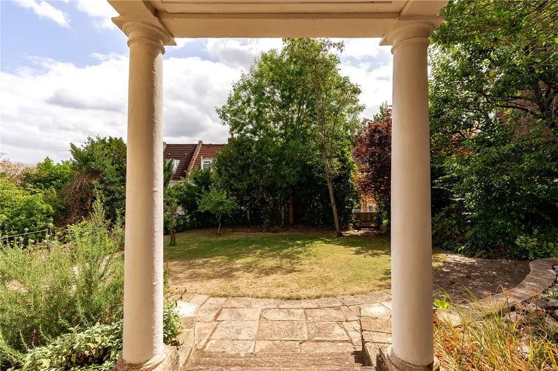 Handsome gardens wrap their way round the property with lawned spaces on the approach and a charming patio space with raised beds at the back.