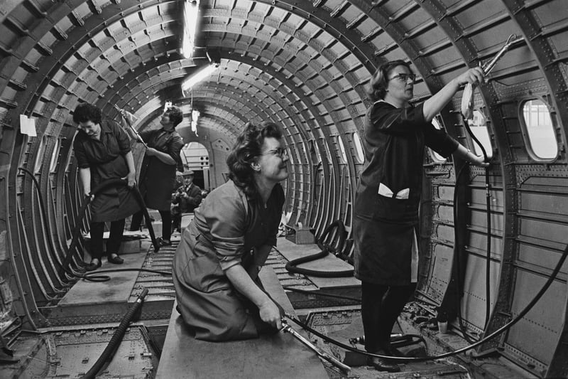 Cleaners at work on the prototype supersonic airliner Concorde 002 at British Aircraft Corporation at Filton