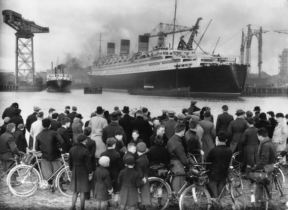 A crowd admires the nearly completed Cunard White Star liner Queen Mary at Clydebank. The launch of a ship would always draw in crowds of Glaswegians, keen to see their family and friends handiwork