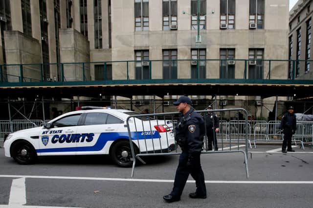 Police set up barricades outside the courtroom ahead of Donald Trump's arraignment. Credit: Getty