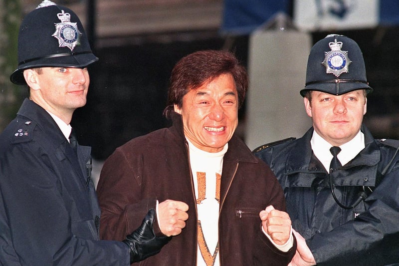 In 1998 Jackie Chan hammed it up with two London “bobbies” while promoting Rush Hour.  (Photo Dave Gaywood/AFP via Getty Images)