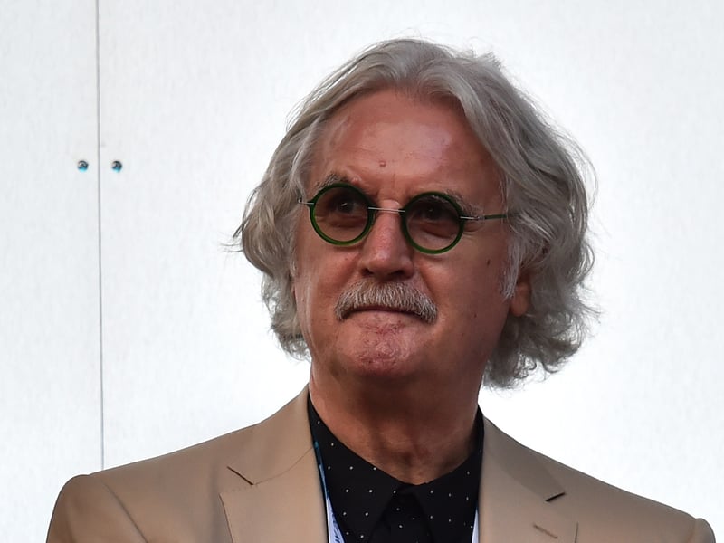 Scottish comedian Billy Connolly awaits the start of the opening ceremony of the 2014 Commonwealth Games at Celtic Park in Glasgow.