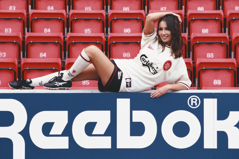 Model Kathy Lloyd poses in the new Liverpool change kit at the launch of the 1996/97 season Reebok strip at Anfield.