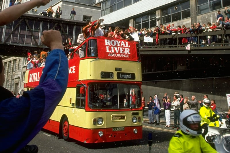 Liverpool supporters greet the team as they return home after their FA Cup Final victory against Sunderland at Wembley Stadium in London.