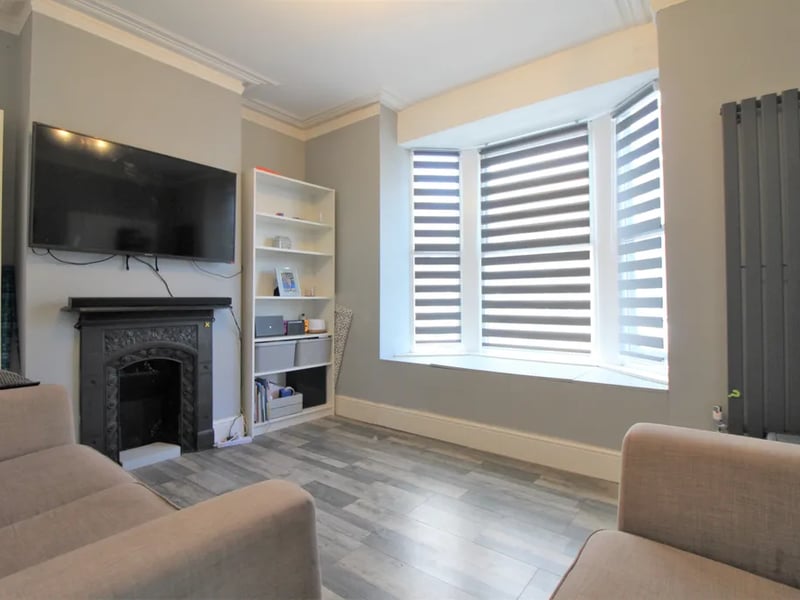 The living room has a bay window
