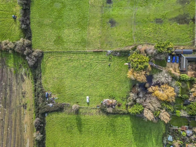 The home is located on a 1.6 acre plot