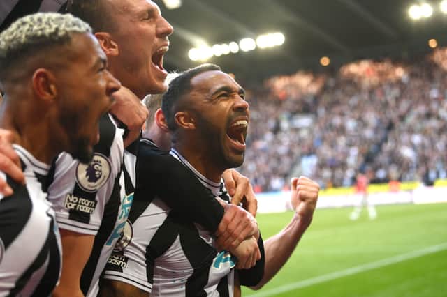 Newcastle striker Callum Wilson celebrates with team mates after scoring the second Newcastle goal during the Premier League match between Newcastle United and Manchester United at St. James Park on April 02, 2023 in Newcastle upon Tyne, England. (Photo by Stu Forster/Getty Images)