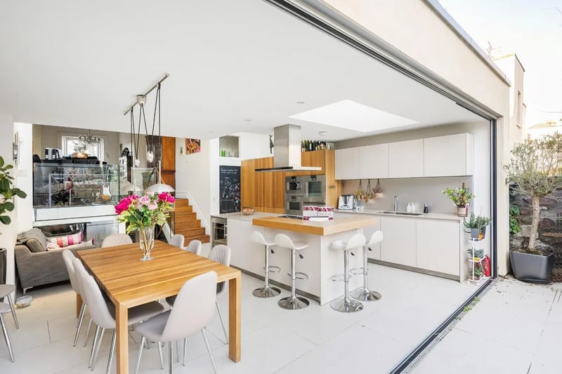 The spacious kitchen and dining area looks right out over the garden, perfect for cooking, dining and entertaining. Imagine this in summer!