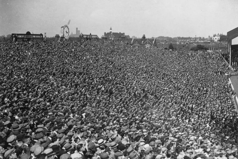A large football crowd at Highbury  to watch Arsenal play Birmingham.