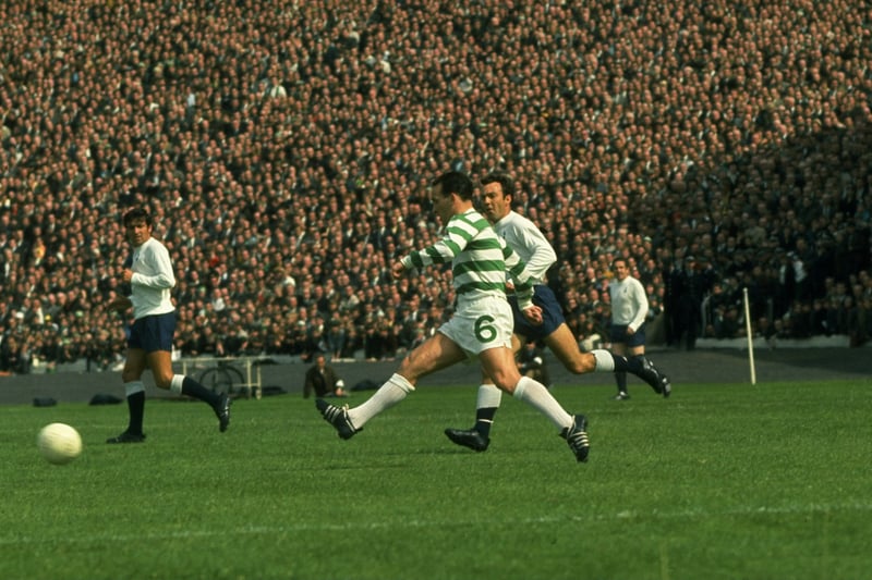 John Clark (centre) of Celtic passes the ball as Terry Venables (left) and Jimmy Greaves (right) of Tottenham Hotspur look on