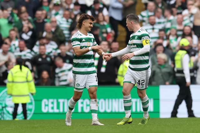 Jota of Celtic celebrates with teammate Callum McGregor after scoring the team's third goal 