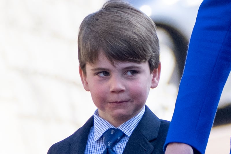 Prince Louis wore a smart blue tie and shorts for the service