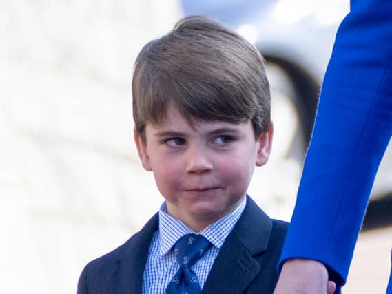 Prince Louis wore a smart blue tie and shorts for the service