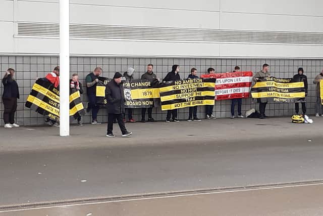 Rovers fans unveil banners protesting about the running of the club. 