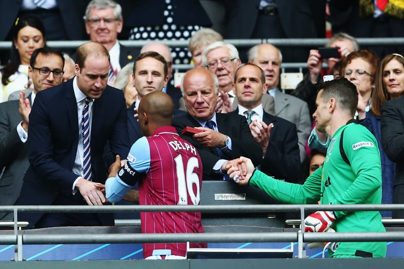 Prince William presents FA Cup runners-up medals to Aston Villa in 2015.