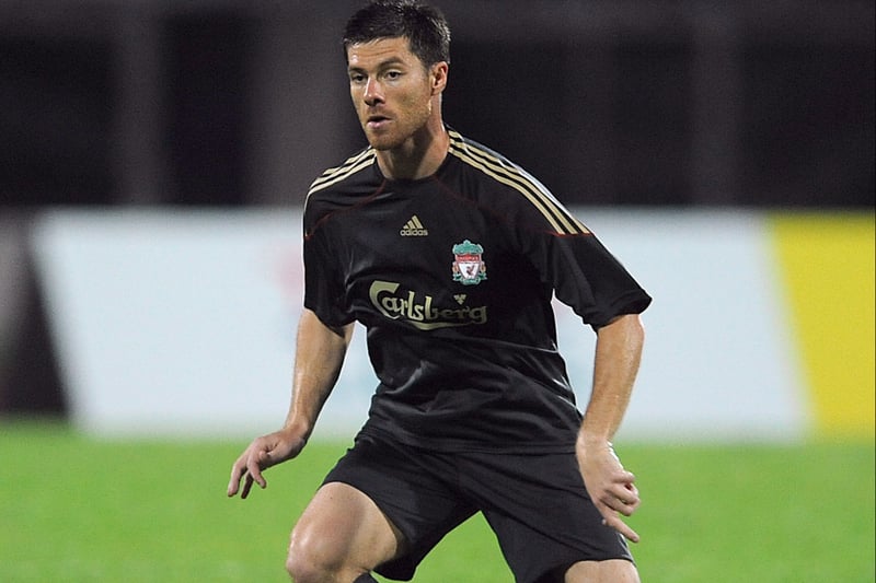 Xabi Alonso sporting the dark away kit from the Adidas and Carlsberg era which fans loved over the years.