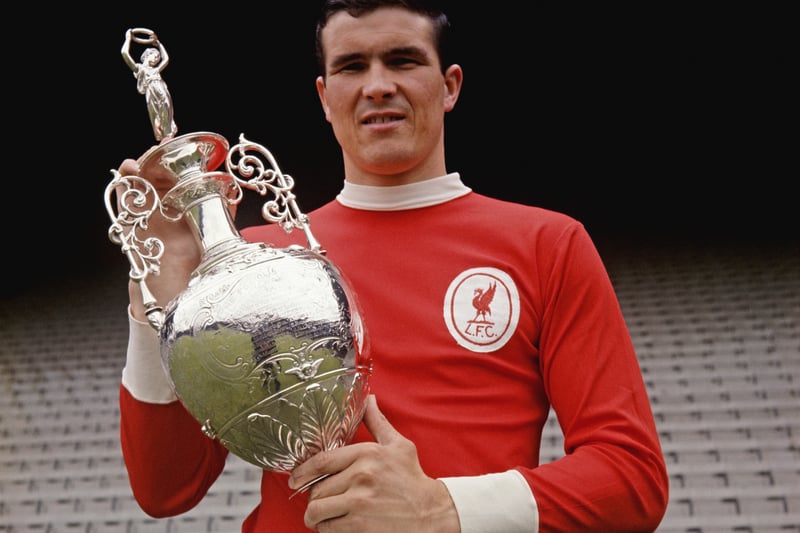 This classic kit with a clean all-red look was worn by the side that won the 1963/64 Division One Championship and is still being sported by the great Ron Yeats here as he poses with the 1965/66 trophy.
