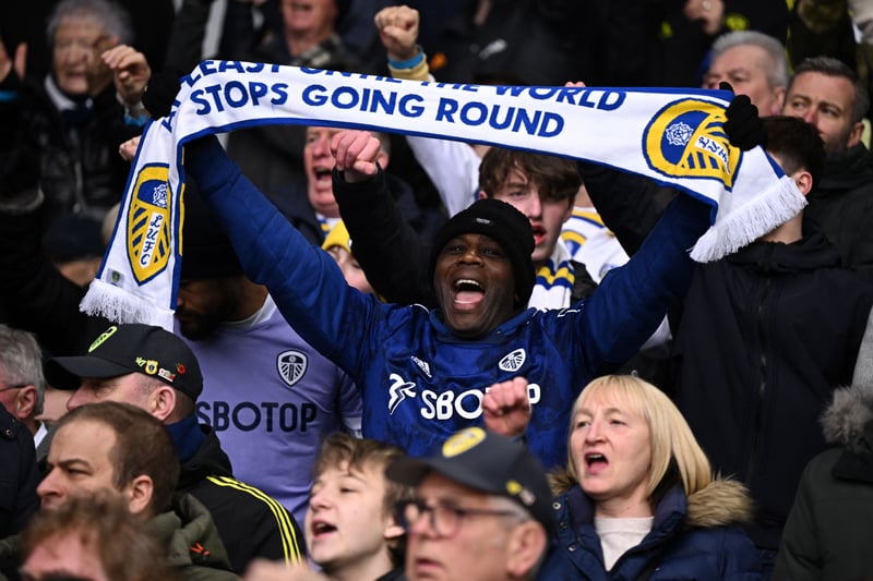 A Leeds fan holds up a scarf in the crowd ahead of the English Premier League football match between Leeds United and Manchester United at Elland Road in Leeds, northern England on February 12, 2023.
