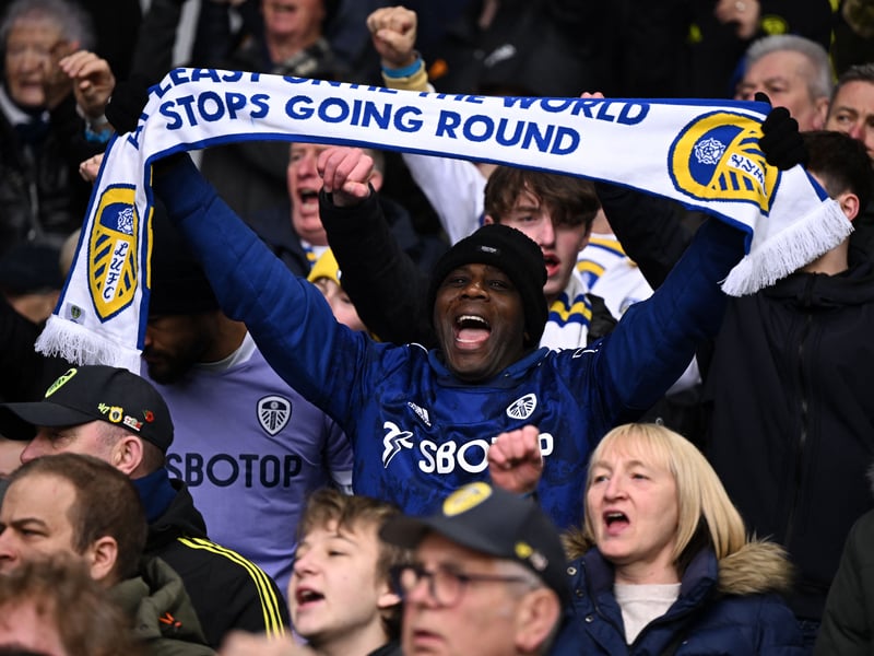 A Leeds fan holds up a scarf in the crowd ahead of the English Premier League football match between Leeds United and Manchester United at Elland Road in Leeds, northern England on February 12, 2023.