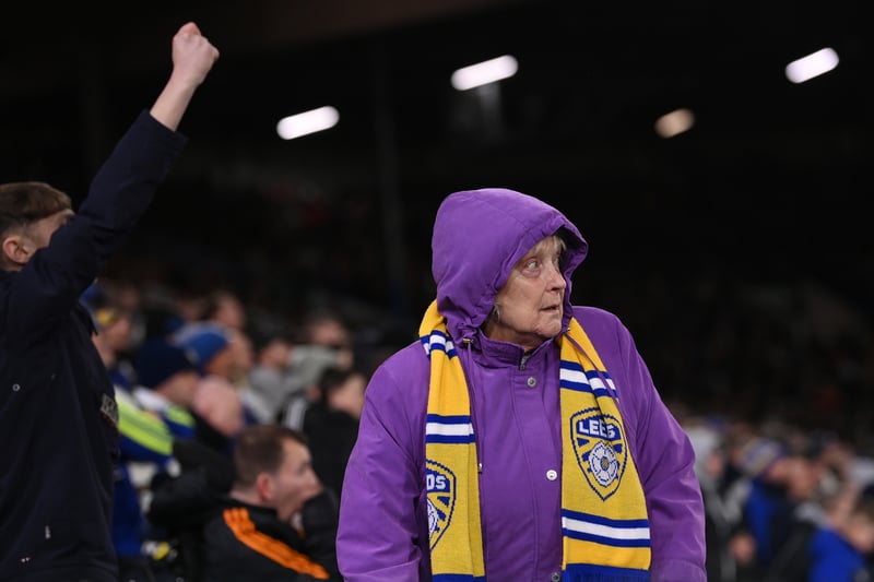 An elderly female Leeds supporter wearing a club scarf looks on during the Premier League match between Leeds United and West Ham United at Elland Road on January 04, 2023.