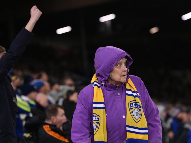 An elderly female Leeds supporter wearing a club scarf looks on during the Premier League match between Leeds United and West Ham United at Elland Road on January 04, 2023.