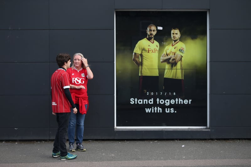 Two Bristol City fans are pictured outside Vicarage Road