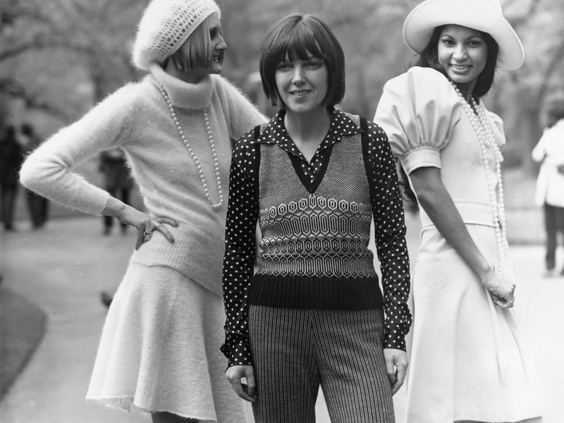 Quant designed for all seasons, but always stayed loyal to her signature style. She pictured in 1972 with two models wearing clothing from her winter collection, including a knitted sweater and skirt - in Quant’s iconic shorter length.