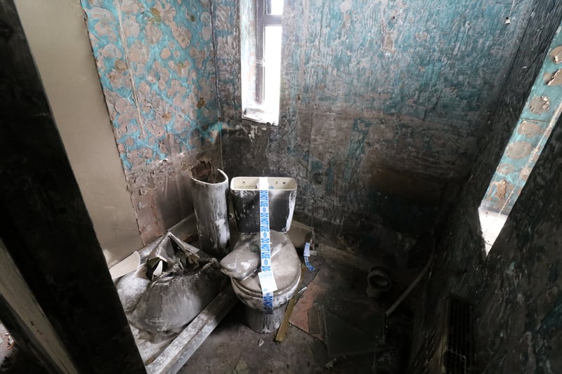 The house of horrors is heading to auction but potential buyers are banned from viewing it in person and the loo is taped off with ‘do not use’ labels. Picture: Auction House Birmingham / SWNS