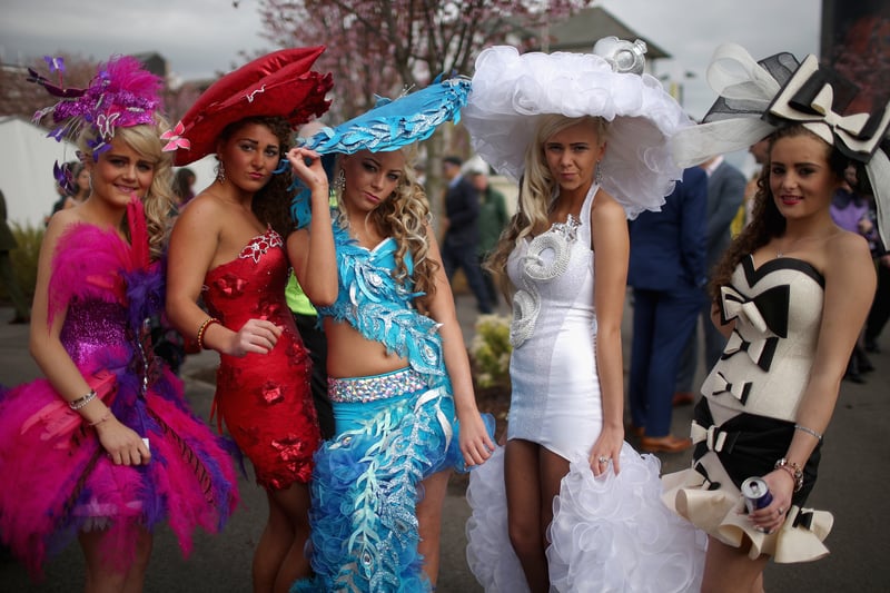 Racegoers in 2014 pose for a photo in their looks.