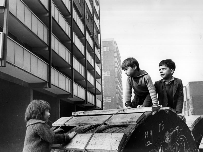 Children playing beside modern tower blocks in the Gorbals. The tenements which had formerly occupied the site were among the worst slums in Britain and there had been campaigns to redevelop the area for many years before work finally began in the late fifties.